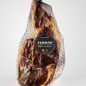 Cured ham wrapped in netting with a label.